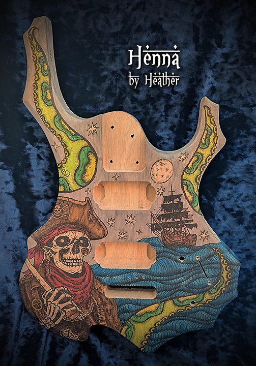 Gibson flame style guitar body featuring wood burned pirate themed art by Heather Caunt-Nulton
